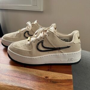Nike Air Force 1 Low Beige with Black and Gold Accents